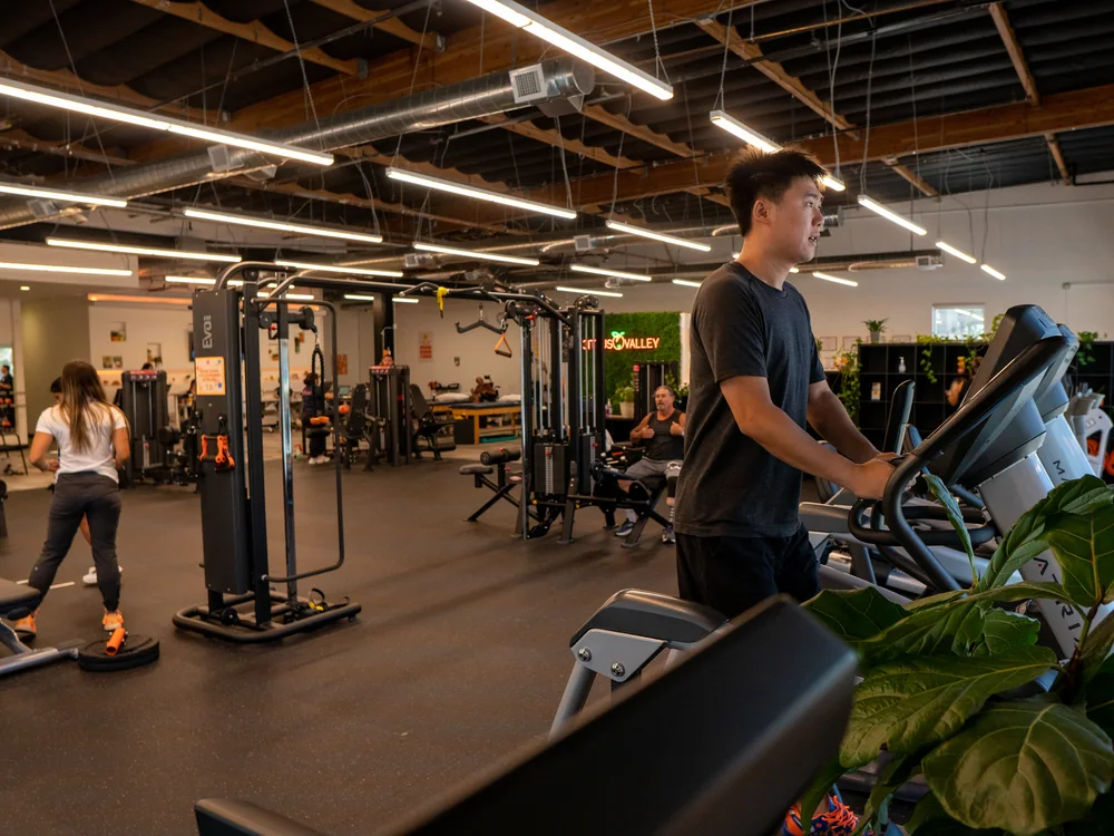 Patient on a cardio machine on the Citrus Valley gym floor